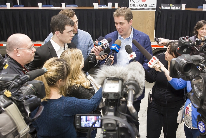 Conservative leader Andrew Scheer surrounded by media at an event in Moosomin in 2019